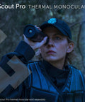 Person using Scout Pro thermal monocular in outdoor setting.
