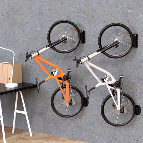 Rock Solid Swivel Bike Wall Mount Rack For Garage holding two bikes with rubber coated hooks on concrete wall, 2 pack.