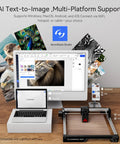 Swift 12W Laser Engraver And Cutter For Wood Metal Dark Acrylic displayed with MacBook and desktop monitor setup