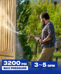 Man using pressure washer with Downstream Injector For Pressure Washer With 3/8 Inch Quick Connect And 10 Ft Siphon Hose Fixed Chemical Injector Kit For 3-5 GPM Easy Detergent Dosing For Cars Driveways Roofs And More Built For Heavy Duty Cleaning, spraying garden fence.