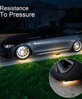 Car parked over Outdoor Rainbow Projection Spotlight 10W Plug In IP65 Waterproof Landscape Light, highlighting pressure resistance.