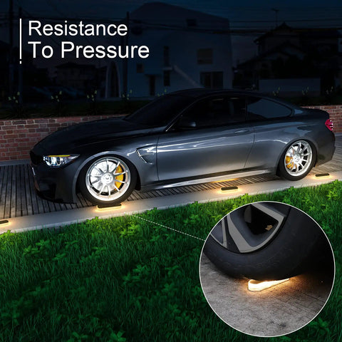 Car parked over Outdoor Rainbow Projection Spotlight 10W Plug In IP65 Waterproof Landscape Light, highlighting pressure resistance.