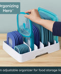 Big Kitchen Cabinet Lid Organizer With Five Adjustable Dividers Gonna Keep Your Pantry Straight No Sweat Sorting Tray For Food Containers Slick Kitchen Helper White with teal lids.