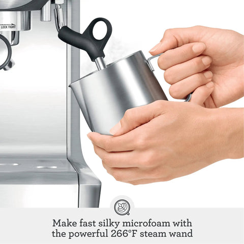 Barista Grade Espresso Machine With Integrated Conical Burr Grinder Bean To Cup Coffee Maker Featuring Manual Steam Wand For Creamy Microfoam, user steaming milk with steam wand.