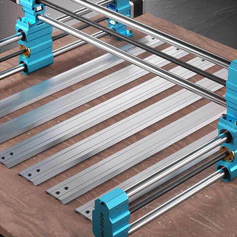 Desktop 4040 Pro CNC Milling Machine with Four Axis Ready components on wooden surface, showcasing steel frame and lead screw drive.