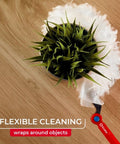 Heavy Duty Dusting Kit With Extendable 3 Ft Handle And Stay On Duster Hook Includes 3 Disposable Refills Traps 3X More Dust Than Feather Dusters Pro Grade Flexible Cleaning Fibers dusting round green plant on wooden table top view