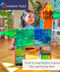 Child playing with Classic 100 Piece Magnetic Construction Set With Translucent Geometric Shapes In Six Colors For Open Ended Building And STEM Fun