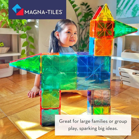 Child playing with Classic 100 Piece Magnetic Construction Set With Translucent Geometric Shapes In Six Colors For Open Ended Building And STEM Fun