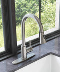YZZY Single Handle Kitchen Sink Faucet with Pull Down Sprayer Stainless Steel Single Hole Bar Faucet High Arc Chrome Pull Out Kitchen Faucet next to window.