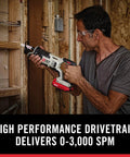 Man using Badass 20V Max Six Tool Cordless Combo Kit reciprocating saw for home repair, showcasing high performance and ease of use.