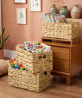Three Pack Wicker Storage Baskets With Handles For Laundry Room And Bedroom Water Hyacinth Woven Bins Medium Size filled with toys