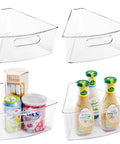 Lazy Susan Organizer Set Of Four Clear Plastic Kitchen Cabinet Storage Bins With Handles, holding condiments and cans