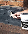 Applying Chimney Flashing Sealer And Roof Sealant That Keeps Water Out on brick chimney, 2.2 kg container visible
