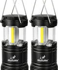 Pair of black Bright 360 Degree COB LED Camping Lantern Powered by Batteries Portable Hanging Collapsible Light for Outdoor Camping Home Emergency Power Outages Hurricane Survival Requires 3 AA Batteries Not Included. Lanterns are shown collapsed with handles extended, against a white background.