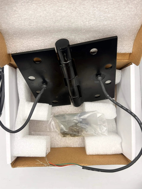 Electrified Steel Hinge Four Wire Electric Hinge Four And A Half Inches By Four And A Half Inches US26D Finish in packaging.