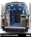 Interior of a service van equipped with Heavy Duty Metal Power Tool Organizer Wall Mount For Five Cordless Drills Locking Drill Dock Enclosed Trailer And Garage Tool Storage Rack Keeps Your Shop Tidy And Your Handyman Essentials Ready To Grab.