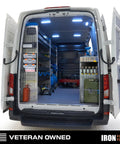 Open van with interior shelving and organized tools, showcasing Heavy Duty Metal Power Tool Organizer Wall Mount Holds Five Drills And Space For Cordless Charger Ideal Garage Storage Rack For Tools Bits And Accessories.