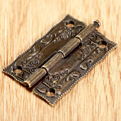 2 Pack Cabinet Door Hinges 36x23mm Wooden Box Decorative Hinges with intricate design on wood surface