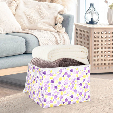 Top Tier Foldable Storage Bin With Sturdy Side Grips For Bedroom Organization Durable Oxford Fabric Collapsible Crate With Snug Flip Lid To Keep Your Room Clutter Free holding blankets in a cozy living room setting.