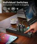 Power Strip With Individual Switches 6 Outlets And 4 USB Ports 900J Surge Protector on desk with electronic devices.