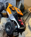 RC car with SCX24 1 By 24 Scale Sticker Sheet Pack Premium Retro OG Style Decals on rocks