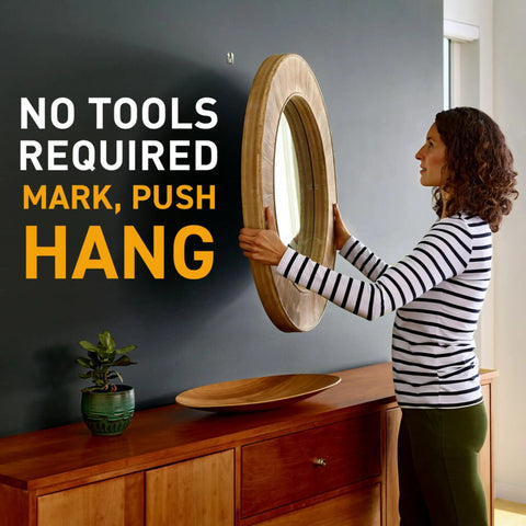 Woman using Claw Drywall Picture Hanger Set, Holds 45 Lbs Per Hook, Includes 3 Hooks And 3 Spot Markers, Stainless Steel Silver Finish, No Studs Needed, Heavy Duty Wall Hanging For Pictures And Mirrors to hang mirror on wall