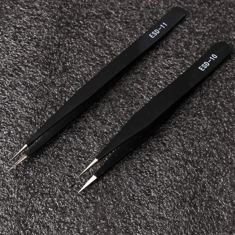 6 Piece ESD Anti Static Tweezers Set In Black Stainless Steel For Electronics Repair Jewelry Making Laboratory Work And Hobbies, ESD-10 and ESD-11 tweezers on textured surface
