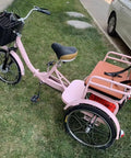 Hassle Free Fold Tandem Tricycle For Adults And Seniors With Rear Bucket Seat And Locking Safety Strap 20 Inch Front Wheel Heavy Duty Steel Frame Bright Pink Chill City Cruisers, side view with front basket.