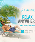 Person relaxing on Teal Open Face Chaise Lounge With Face Cavity Design, Arm Slots, And Plush Pillow, Ultra Lightweight Foldable Tanning Lounger on beach