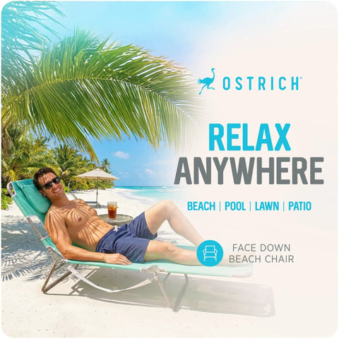 Person relaxing on Teal Open Face Chaise Lounge With Face Cavity Design, Arm Slots, And Plush Pillow, Ultra Lightweight Foldable Tanning Lounger on beach