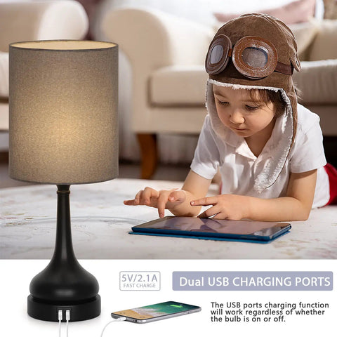 Touch Bedside Lamps Set Of 2 With Dual USB Ports, Nightstand Table Lamps For Bedroom And Living Room, Gray Fabric Shade And Black Vase Base, Easy Tap Control, USB Charging For Phone And Tablet, Bulbs Not Included shown with a child using a tablet.