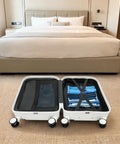 20 Inch Carry On Suitcase With Built In Cup Holder And Usb Charging Port Hardshell Travel Bag opened in hotel room with packed clothes.