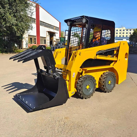 Compact skid steer loader with quick tach system on pavement, designed for repair, debris removal, and barn cleaning.