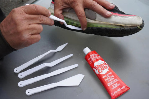 Clear Shoe Repair Adhesive Bundle With 3.7 Fl Oz Tube, 10 Snip Tip Applicators, And 5 Plastic Spreader Tools used on sneaker sole