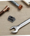 Six Piece Slot Fastening Nuts And Bolts Set For T Slot Tracks And Machine Tool Applications lying on textured surface
