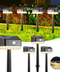 Solar Pathway Lights With Motion Sensor Waterproof Outdoor LED 2 In 1 Lights installed in a garden, showing warm white illumination
