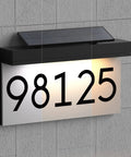 Solar Powered House Numbers Address Plaque With Adjustable Solar Panel And Three Color Lighting For Outdoor Use Waterproof Lighted Address Sign Includes Numbers 0 1 2 3 4 5 6 7 8 9 And Letters A mounted on wall