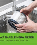 Hands cleaning a washable HEPA filter under running water for Workhorse Cordless 3-Gallon Wet And Dry Shop Vacuum Kit With Hose, Crevice Tool.