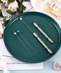 Slick Eight Piece Double Ended Pin Vise Set With Copper Collets Alloy Hand Drill For Jewelry Making Resin Drilling on green plate.