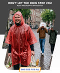 Person wearing Disposable Rain Ponchos For Adults 5 Pack Hooded Full-Size 48 X 40 Inches Stay Dry On The Go in red, carrying bags