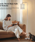 Cozy living room scene with industrial floor lamp for living room with HD glass lampshade and pedal switch, cat relaxing nearby.