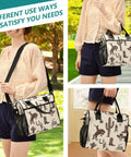 Woman holding Western Cowboys Desert Insulated Lunch Bag With Adjustable Shoulder Strap in desert-themed design.