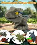 Velociraptor finger biting toy against forest background, dinosaur playset for kids, light gray with yellow eyes, portable design.