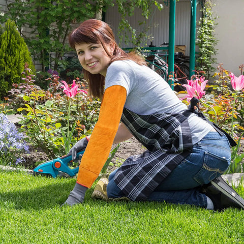 Pro Level Heavy Duty Cowhide Leather Arm Sleeves Heat Resistant Double Layer Welding Oversleeves worn by woman gardening.