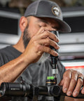 Individual using Pro Torque Wrench For Riflescopes With 10 To 90 In Lbs Torque Range 13 Bit Kit on mounted riflescope