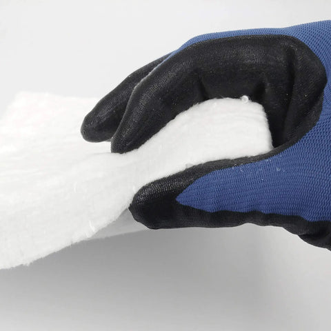 Kickass Heavy Duty Ceramic Fiber Insulation Blanket One Inch Thick By Twelve By Twenty Four Inches held with gloved hand.