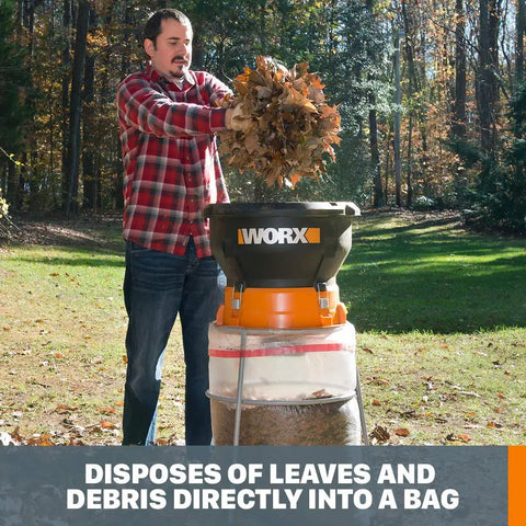 Person using 13 Amp Corded Leaf Mulcher Shredder With High-Compression Mulching in backyard