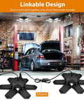 Installed Two Pack 160W 16000LM Daylight LED Garage Light with car in garage, showing linkable design and adjustable panels.