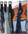 Installed 48-Piece Heavy Duty Extension Cord Organizer Set for Workshop Garage and RV, holding ropes with wall mounts.