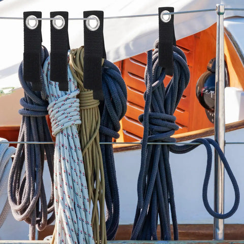 Installed 48-Piece Heavy Duty Extension Cord Organizer Set for Workshop Garage and RV, holding ropes with wall mounts.